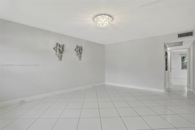 481 Durham Q Unit 481, Deerfield Beach, FL 33442 - empty room featuring baseboards, light tile patterned floors, and a textured ceiling