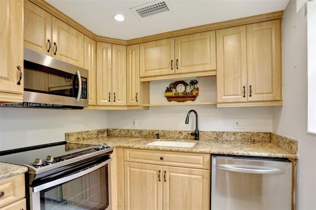 481 Durham Q Unit 481, Deerfield Beach, FL 33442 - kitchen featuring appliances with stainless steel finishes, a sink, light brown cabinets, light stone counters, and recessed lighting