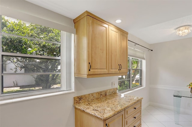 481 Durham Q Unit 481, Deerfield Beach, FL 33442 - kitchen with light brown cabinetry, light stone counters, light tile patterned floors, baseboards, and recessed lighting
