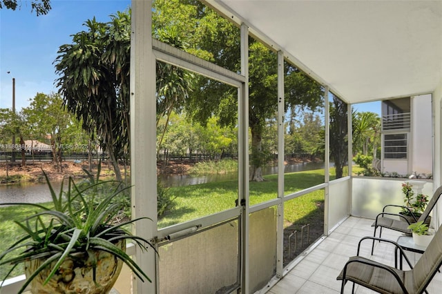 481 Durham Q Unit 481, Deerfield Beach, FL 33442 - unfurnished sunroom featuring a water view and view of wooded area