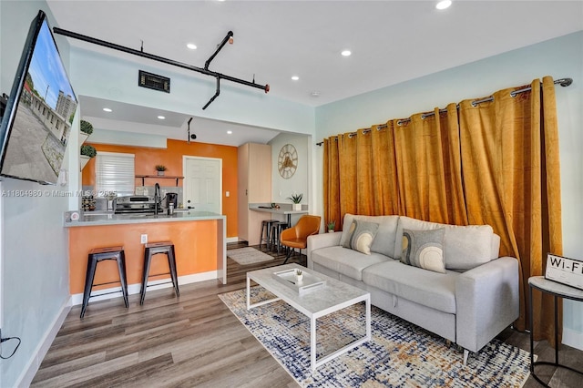 1085 NE 126th St, North Miami Beach, FL 33161 - living room featuring wood finished floors, recessed lighting, and baseboards