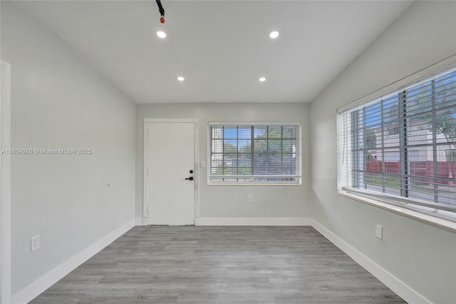 1085 NE 126th St, North Miami Beach, FL 33161 - spare room with plenty of natural light, recessed lighting, baseboards, and wood finished floors