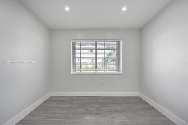 1085 NE 126th St, North Miami Beach, FL 33161 - spare room featuring recessed lighting, baseboards, and wood finished floors
