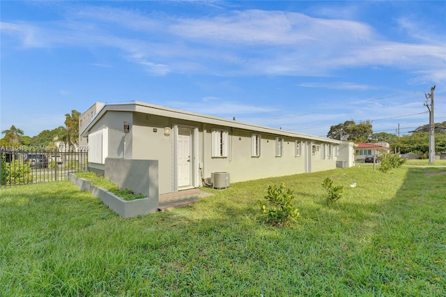 1085 NE 126th St, North Miami Beach, FL 33161 - view of side of property with stucco siding and central AC unit