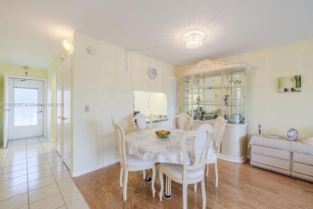 2333 Indian River Blvd Unit 306, Vero Beach, FL 32960 - dining space with light tile patterned flooring and baseboards