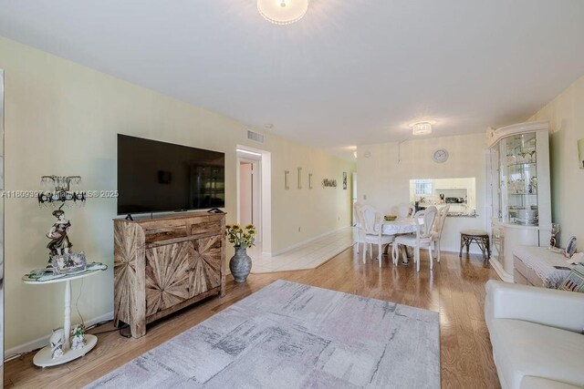 2333 Indian River Blvd Unit 306, Vero Beach, FL 32960 - living area with wood finished floors