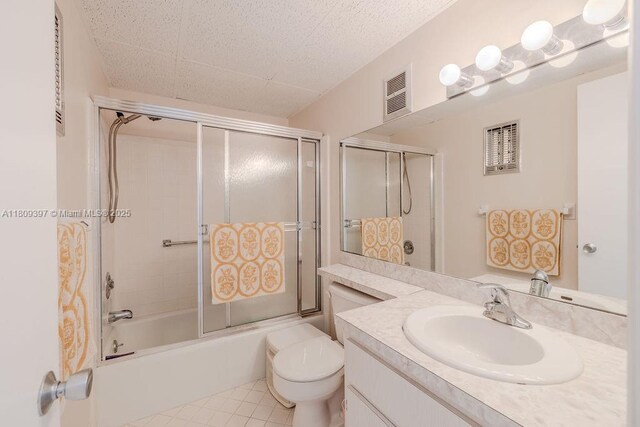 2333 Indian River Blvd Unit 306, Vero Beach, FL 32960 - full bath with vanity, toilet, shower / bath combination with glass door, and tile patterned flooring