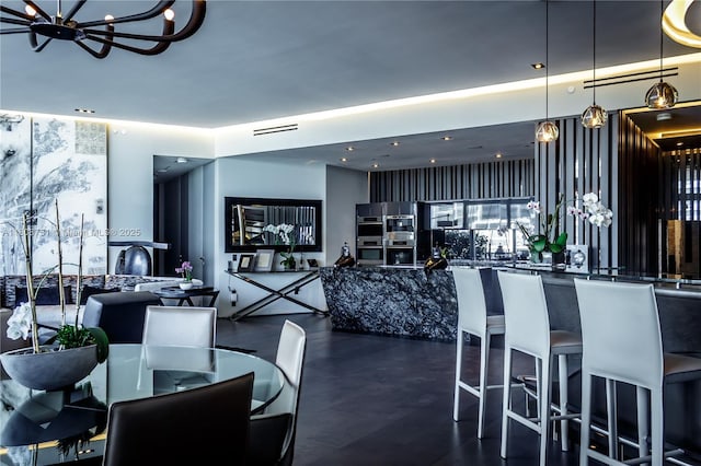 200 Biscayne Boulevard Way Unit 5404, Miami, FL 33131 - dining area featuring a chandelier and recessed lighting