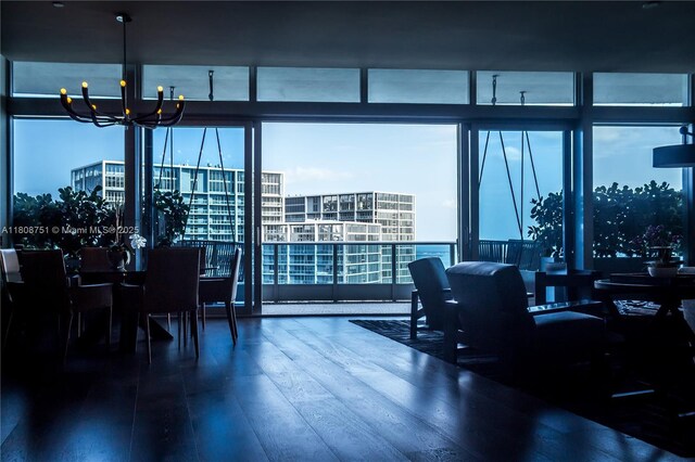 200 Biscayne Boulevard Way Unit 5404, Miami, FL 33131 - dining space with a chandelier, wood finished floors, and expansive windows
