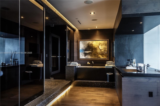 200 Biscayne Boulevard Way Unit 5404, Miami, FL 33131 - full bathroom featuring a garden tub, wood finished floors, a stall shower, and a sink