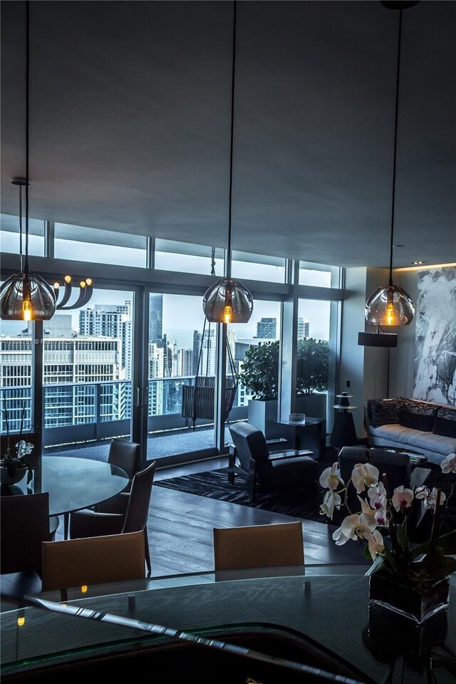 200 Biscayne Boulevard Way Unit 5404, Miami, FL 33131 - dining space featuring plenty of natural light, wood finished floors, expansive windows, and a chandelier