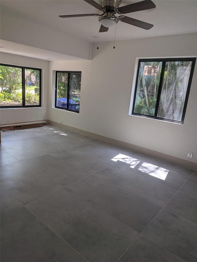 421 SW 11th St, Fort Lauderdale, FL 33315 - spare room featuring a ceiling fan, baseboards, and tile patterned flooring