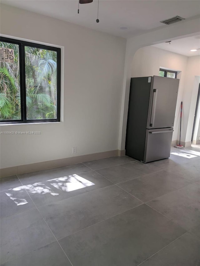 421 SW 11th St, Fort Lauderdale, FL 33315 - tiled empty room featuring plenty of natural light, ceiling fan, and baseboards