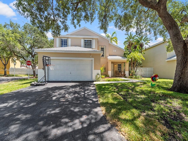 14474 SW 144th Ter, Miami, FL 33186 - traditional home with asphalt driveway and stucco siding