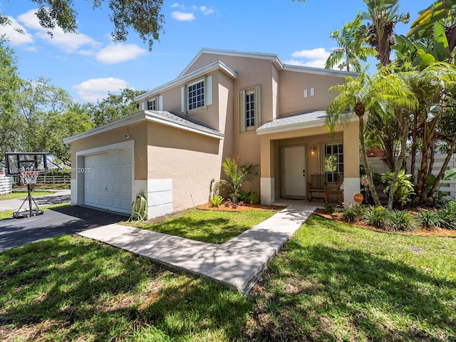 14474 SW 144th Ter, Miami, FL 33186 - traditional-style house featuring stucco siding, a front lawn, and asphalt driveway