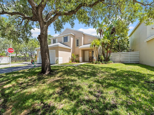 14474 SW 144th Ter, Miami, FL 33186 - view of front of home featuring driveway, stucco siding, and a garage