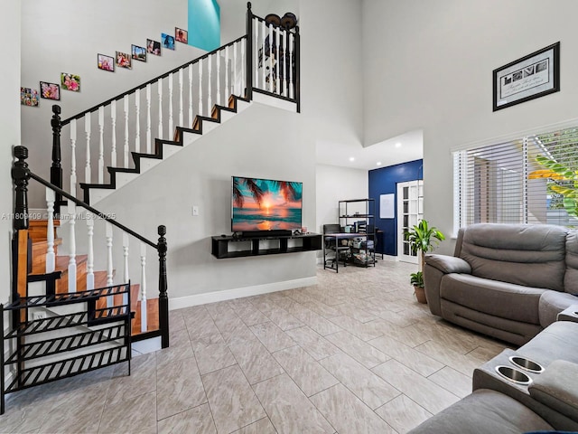 14474 SW 144th Ter, Miami, FL 33186 - living area featuring baseboards, marble look tiles, stairway, and a high ceiling