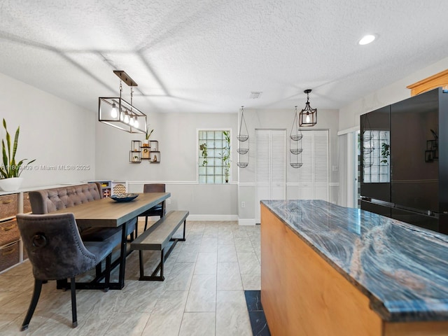 14474 SW 144th Ter, Miami, FL 33186 - kitchen featuring plenty of natural light, a textured ceiling, baseboards, pendant lighting, and recessed lighting