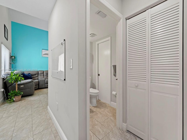 14474 SW 144th Ter, Miami, FL 33186 - corridor featuring baseboards and a towering ceiling