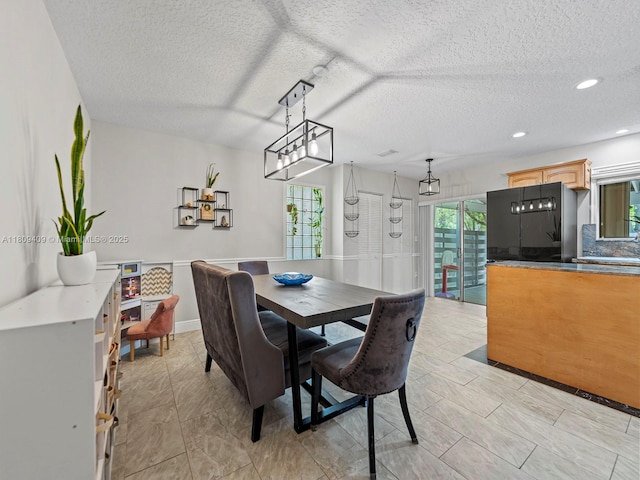 14474 SW 144th Ter, Miami, FL 33186 - dining room featuring a textured ceiling and recessed lighting