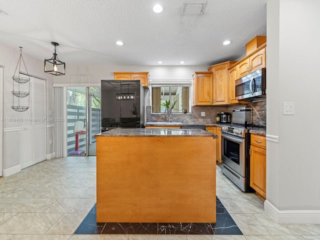 14474 SW 144th Ter, Miami, FL 33186 - kitchen with stainless steel appliances, a center island, a sink, tasteful backsplash, and light marble finish floors