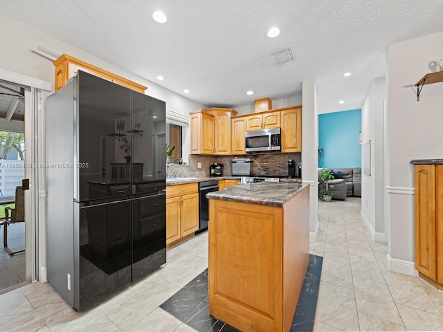14474 SW 144th Ter, Miami, FL 33186 - kitchen featuring black appliances, a center island, decorative backsplash, light marble finish flooring, and recessed lighting