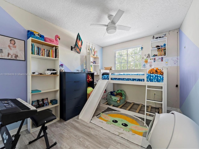 14474 SW 144th Ter, Miami, FL 33186 - bedroom with a textured ceiling, wood finished floors, and ceiling fan