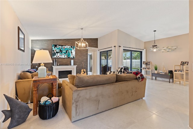 14912 SW 139th Ave, Miami, FL 33186 - living area with a chandelier, a fireplace, light tile patterned floors, and vaulted ceiling