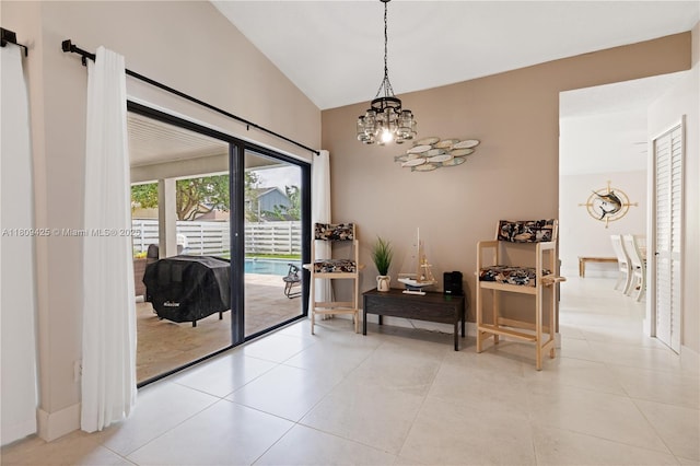 14912 SW 139th Ave, Miami, FL 33186 - hallway with a chandelier, vaulted ceiling, light tile patterned floors, and baseboards