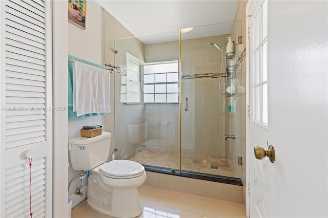 14912 SW 139th Ave, Miami, FL 33186 - bathroom with toilet, a shower stall, tile patterned flooring, and a closet
