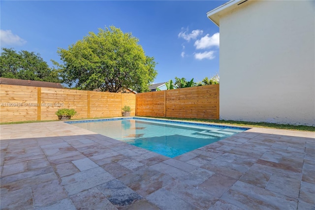 14912 SW 139th Ave, Miami, FL 33186 - view of swimming pool featuring a patio and a fenced backyard