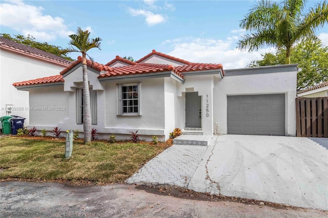 11250 SW 157th Ct, Miami, FL 33196 - mediterranean / spanish house featuring a garage, driveway, stucco siding, and a tile roof