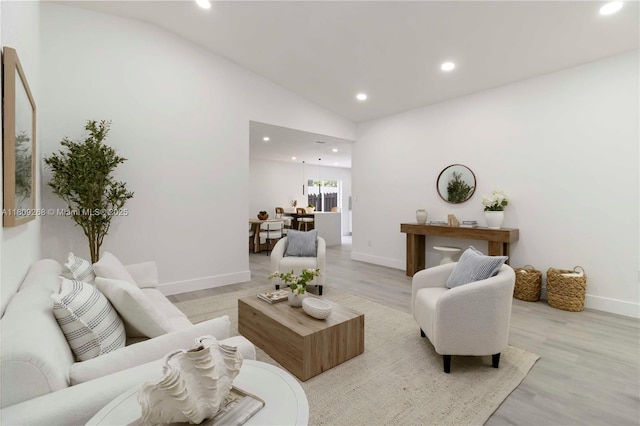 11250 SW 157th Ct, Miami, FL 33196 - living room featuring lofted ceiling, baseboards, light wood-style floors, and recessed lighting