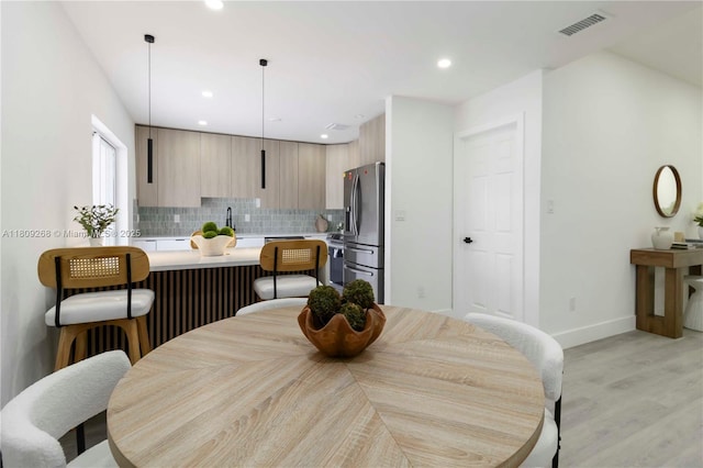 11250 SW 157th Ct, Miami, FL 33196 - dining space with light wood-type flooring, baseboards, and recessed lighting
