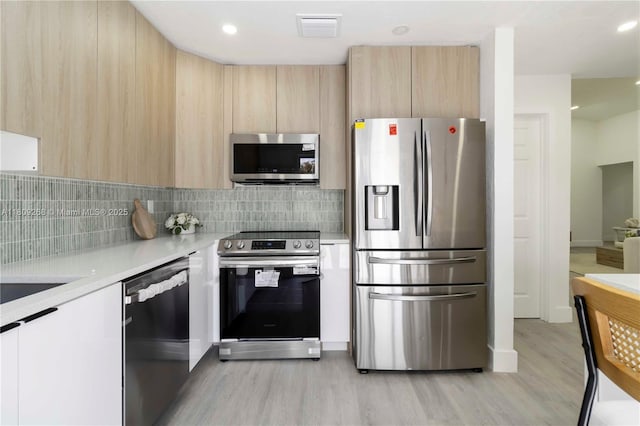 11250 SW 157th Ct, Miami, FL 33196 - kitchen featuring appliances with stainless steel finishes, modern cabinets, light brown cabinets, light countertops, and recessed lighting