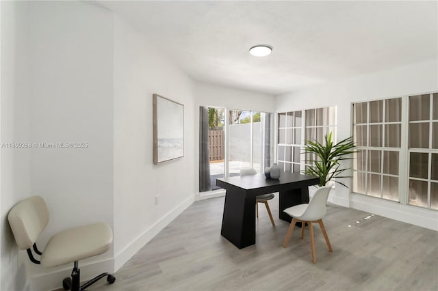 11250 SW 157th Ct, Miami, FL 33196 - dining space featuring a desk, baseboards, and light wood-style floors