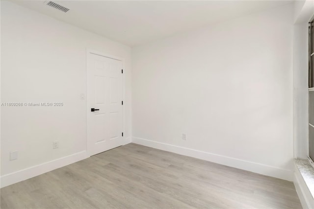 11250 SW 157th Ct, Miami, FL 33196 - empty room with light wood finished floors and baseboards