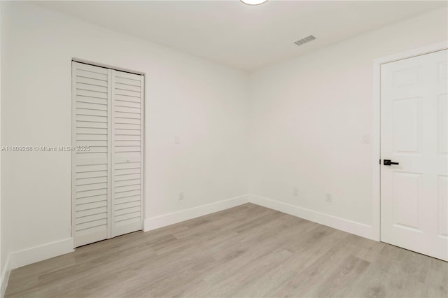 11250 SW 157th Ct, Miami, FL 33196 - unfurnished bedroom featuring light wood-style flooring, baseboards, and a closet