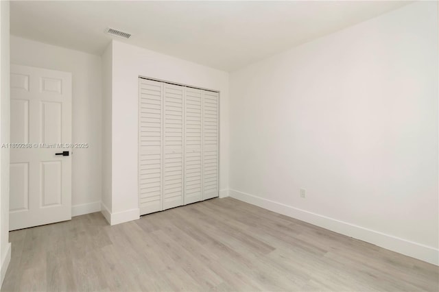 11250 SW 157th Ct, Miami, FL 33196 - unfurnished bedroom with light wood-style floors, baseboards, and a closet