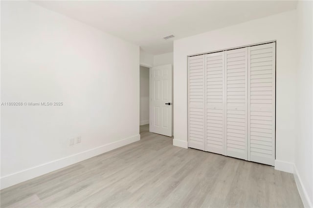 11250 SW 157th Ct, Miami, FL 33196 - unfurnished bedroom featuring light wood finished floors, baseboards, and a closet