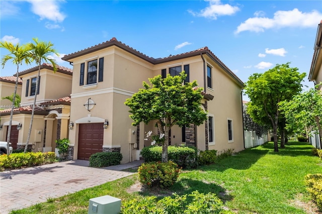 3336 W 91st Ter, Hialeah, FL 33018 - mediterranean / spanish home featuring an attached garage, stucco siding, a front yard, and a tiled roof