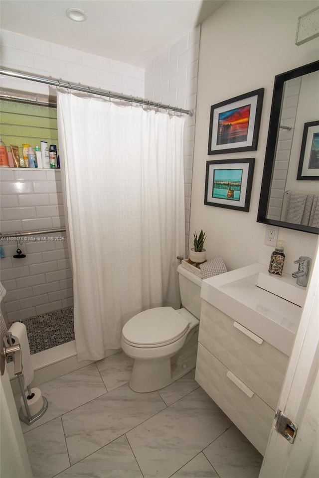 9301 SW 37th St, Miami, FL 33165 - bathroom with marble look tiles, vanity, toilet, and tiled shower