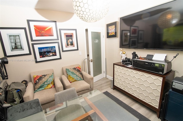 9301 SW 37th St, Miami, FL 33165 - living area featuring light wood-type flooring, french doors, and baseboards