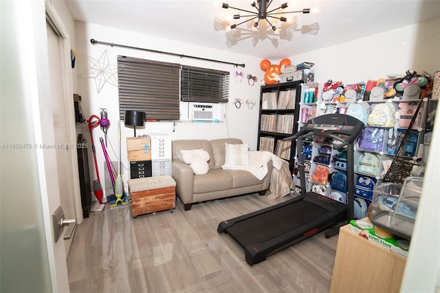 9301 SW 37th St, Miami, FL 33165 - exercise area featuring wood finished floors, a chandelier, and cooling unit