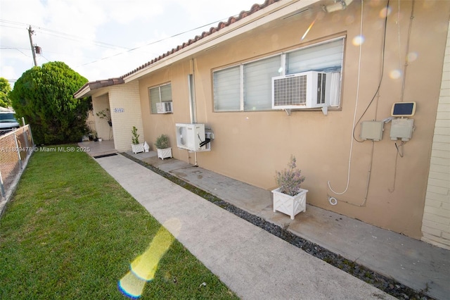 9301 SW 37th St, Miami, FL 33165 - view of property exterior featuring stucco siding, a patio area, cooling unit, and a tiled roof