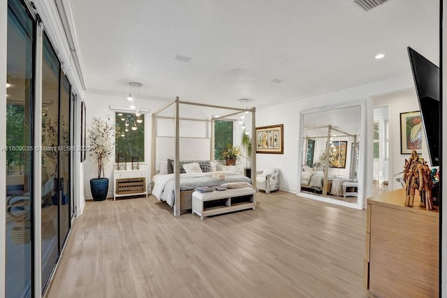 8580 Egret Lakes Ln, West Palm Beach, FL 33412 - bedroom with light wood finished floors and baseboards