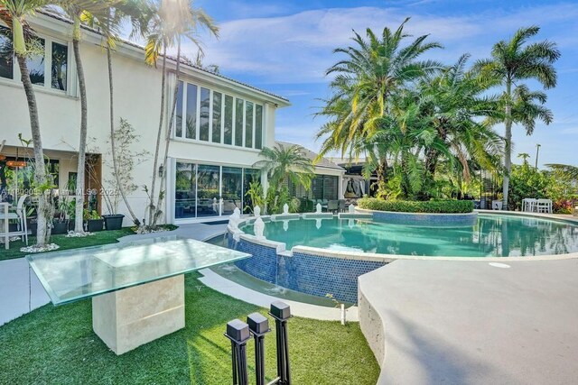 8580 Egret Lakes Ln, West Palm Beach, FL 33412 - view of pool featuring an infinity pool, a patio, and a yard