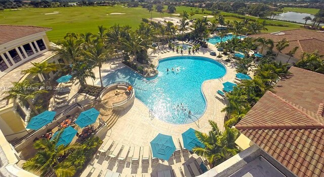 8580 Egret Lakes Ln, West Palm Beach, FL 33412 - community pool with a patio