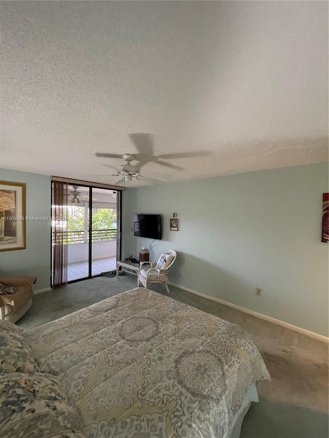 1480 Sheridan St Unit 17B, Hollywood, FL 33020 - carpeted bedroom featuring access to exterior, a textured ceiling, baseboards, and ceiling fan