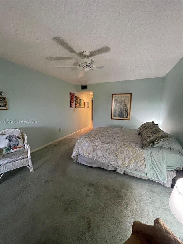 1480 Sheridan St Unit 17B, Hollywood, FL 33020 - carpeted bedroom with a ceiling fan, a textured ceiling, and baseboards